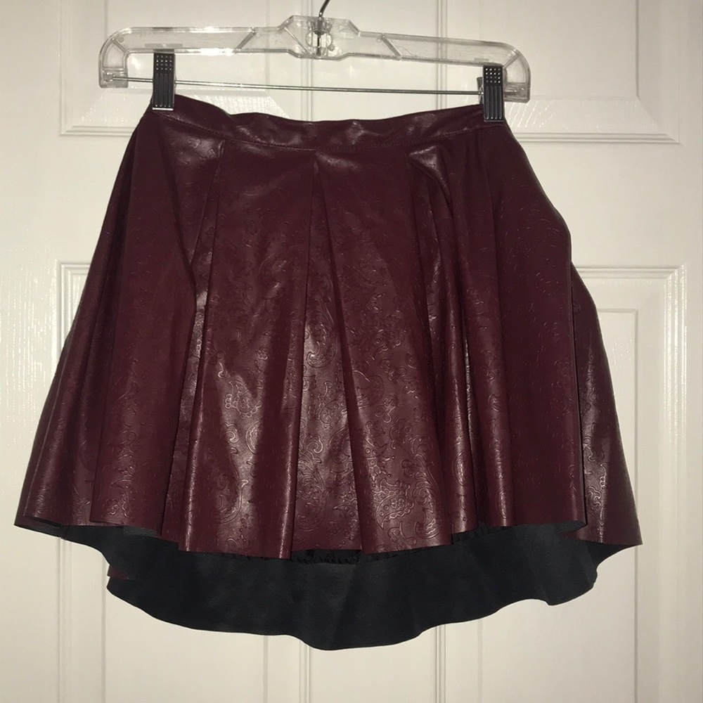 Burgundy colored skirt with designs